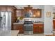 Well-equipped kitchen with stainless steel appliances and granite countertops at 5745 Sagamore Canyon St, North Las Vegas, NV 89081