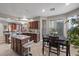 Spacious kitchen with granite countertops, island with breakfast bar, and dining area at 5745 Sagamore Canyon St, North Las Vegas, NV 89081