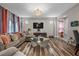 Comfortable living room featuring stylish decor, hardwood floors, and ample seating at 5745 Sagamore Canyon St, North Las Vegas, NV 89081