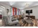 Comfortable living room featuring stylish decor, hardwood floors, and ample seating at 5745 Sagamore Canyon St, North Las Vegas, NV 89081