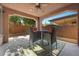 Enjoy the outdoors on this covered patio with stylish furniture and a view of the backyard at 5745 Sagamore Canyon St, North Las Vegas, NV 89081