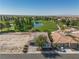 Aerial view of a residential property near a golf course, showcasing lush greenery and scenic landscaping at 5747 Jaborandi Ave, Pahrump, NV 89061