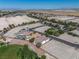 Aerial shot showcasing the property's spacious surroundings, landscaping, and community features in distance at 5747 Jaborandi Ave, Pahrump, NV 89061