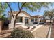 Private backyard featuring a patio with a pergola, desert landscaping, and comfortable seating at 5747 Jaborandi Ave, Pahrump, NV 89061