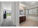 The primary bathroom has dual sinks, a walk-in shower, a soaking tub, and backyard golf course views at 5747 Jaborandi Ave, Pahrump, NV 89061