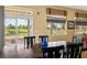 Dining area features a sliding glass door with golf course views and lots of natural light at 5747 Jaborandi Ave, Pahrump, NV 89061