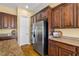 Gourmet kitchen featuring granite countertops, stainless steel appliances, and custom cabinetry at 5747 Jaborandi Ave, Pahrump, NV 89061