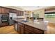 Spacious kitchen features stainless steel appliances, a double oven, and a granite-topped island with a sink at 5747 Jaborandi Ave, Pahrump, NV 89061