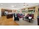 Open concept living area featuring hardwood floors, natural lighting, and comfortable furnishings at 5747 Jaborandi Ave, Pahrump, NV 89061