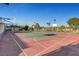 Community basketball court featuring painted lines and well-maintained surface and secure fencing at 6230 Calm Brook Ct, Las Vegas, NV 89149