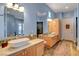 Dual-sink bathroom vanity with cabinets and ample counter space at 6230 Calm Brook Ct, Las Vegas, NV 89149