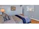 Spacious bedroom with comfortable bed, plush pillows, and tiled floor at 6230 Calm Brook Ct, Las Vegas, NV 89149