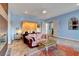 Comfortable bedroom with a sitting area, soft lighting, and a cozy ambiance at 6230 Calm Brook Ct, Las Vegas, NV 89149