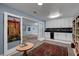 Versatile bonus room features a wet bar and lots of cabinets plus easy access to adjacent areas for relaxation at 6230 Calm Brook Ct, Las Vegas, NV 89149