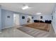 Spacious bonus room with tile and carpet, featuring multiple entry points and versatile layout at 6230 Calm Brook Ct, Las Vegas, NV 89149