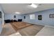 Spacious bonus room with a large area rug and marble floors, ideal for versatile use at 6230 Calm Brook Ct, Las Vegas, NV 89149