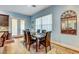 Charming dining room area featuring a decorative mirror at 6230 Calm Brook Ct, Las Vegas, NV 89149
