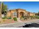 Charming single-story home with a stucco facade, stone accents, and landscaped front yard at 6230 Calm Brook Ct, Las Vegas, NV 89149