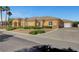 Stunning single-story stucco home with stone accents and well-maintained desert landscaping at 6230 Calm Brook Ct, Las Vegas, NV 89149