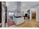 Open-concept kitchen featuring granite countertops, stainless steel appliances, and a large island at 6230 Calm Brook Ct, Las Vegas, NV 89149