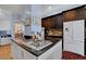 Gourmet kitchen features granite countertops, a center island, and stainless steel appliances at 6230 Calm Brook Ct, Las Vegas, NV 89149