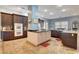 Spacious kitchen with a center island, stainless steel appliances, and modern cabinets at 6230 Calm Brook Ct, Las Vegas, NV 89149