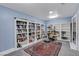 Inviting home library with custom built-in bookshelves, elegant furniture, and a decorative area rug at 6230 Calm Brook Ct, Las Vegas, NV 89149