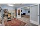 Charming library featuring built-in bookshelves, a comfortable seating area, and a doorway to another room at 6230 Calm Brook Ct, Las Vegas, NV 89149