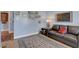 Relaxing living area with a comfortable gray sofa and decorative wall art at 6230 Calm Brook Ct, Las Vegas, NV 89149