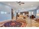 Open-concept living space with a view into the kitchen and dining area at 6230 Calm Brook Ct, Las Vegas, NV 89149