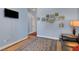 Cozy living room with blue walls, tiled floor, and decorative area rug at 6230 Calm Brook Ct, Las Vegas, NV 89149
