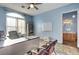 Bright office space with a large window, desk, and adjacent bathroom at 6230 Calm Brook Ct, Las Vegas, NV 89149