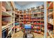 Walk-in pantry with ample shelving for storage of food and kitchen appliances at 6230 Calm Brook Ct, Las Vegas, NV 89149