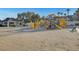 Community playground with yellow slides and climbing structures in a common area at 6230 Calm Brook Ct, Las Vegas, NV 89149