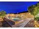 Beautiful backyard oasis with a sparkling pool, outdoor dining area, and landscaped surroundings at 6230 Calm Brook Ct, Las Vegas, NV 89149