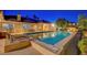 Gorgeous pool with spa, lounge chairs, and landscaped yard for ultimate relaxation and outdoor enjoyment at 6230 Calm Brook Ct, Las Vegas, NV 89149