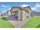 Well-maintained backyard features a covered patio, brick pavers, and a grassy area for outdoor enjoyment at 625 Honesty Ct, Henderson, NV 89011