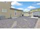 Paver-covered backyard with AC unit, outdoor grill, and additional storage, offering ample space at 625 Honesty Ct, Henderson, NV 89011