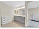 Bright bathroom with double sinks, gray cabinets, and modern lighting at 625 Honesty Ct, Henderson, NV 89011