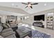 Open concept living room with vaulted ceilings, ample sunlight, and neutral decor at 625 Honesty Ct, Henderson, NV 89011