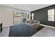 Comfortable living room with a dark accent wall, large sliding doors, and a cozy atmosphere at 625 Honesty Ct, Henderson, NV 89011
