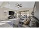 Bright living room with modern decor and a sliding glass door leading to the patio at 625 Honesty Ct, Henderson, NV 89011