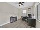 Bright office featuring wood floors, a ceiling fan, and a large window providing plenty of natural light at 625 Honesty Ct, Henderson, NV 89011