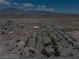Aerial shot of a neighborhood with multiple single-Gathering homes with mountain views in the background at 654 Mazelle Ln, Pahrump, NV 89060