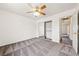 Bedroom featuring a ceiling fan, carpeted floors, and neutral decor at 654 Mazelle Ln, Pahrump, NV 89060