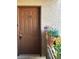 Welcoming entryway with decorative planters and a secure, numbered door at 6865 Tamarus St # 202, Las Vegas, NV 89119