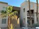 Contemporary apartment building featuring private balconies and desert landscaping at 6865 Tamarus St # 202, Las Vegas, NV 89119