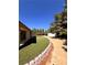 Artificial turf and desert landscaping in backyard at 7255 W La Madre Way, Las Vegas, NV 89149