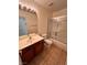 Bathroom featuring a vanity, a toilet, and a combination tub and shower at 7255 W La Madre Way, Las Vegas, NV 89149