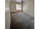 Bedroom features neutral carpet, ceiling fan, and large window providing ample natural light at 7255 W La Madre Way, Las Vegas, NV 89149